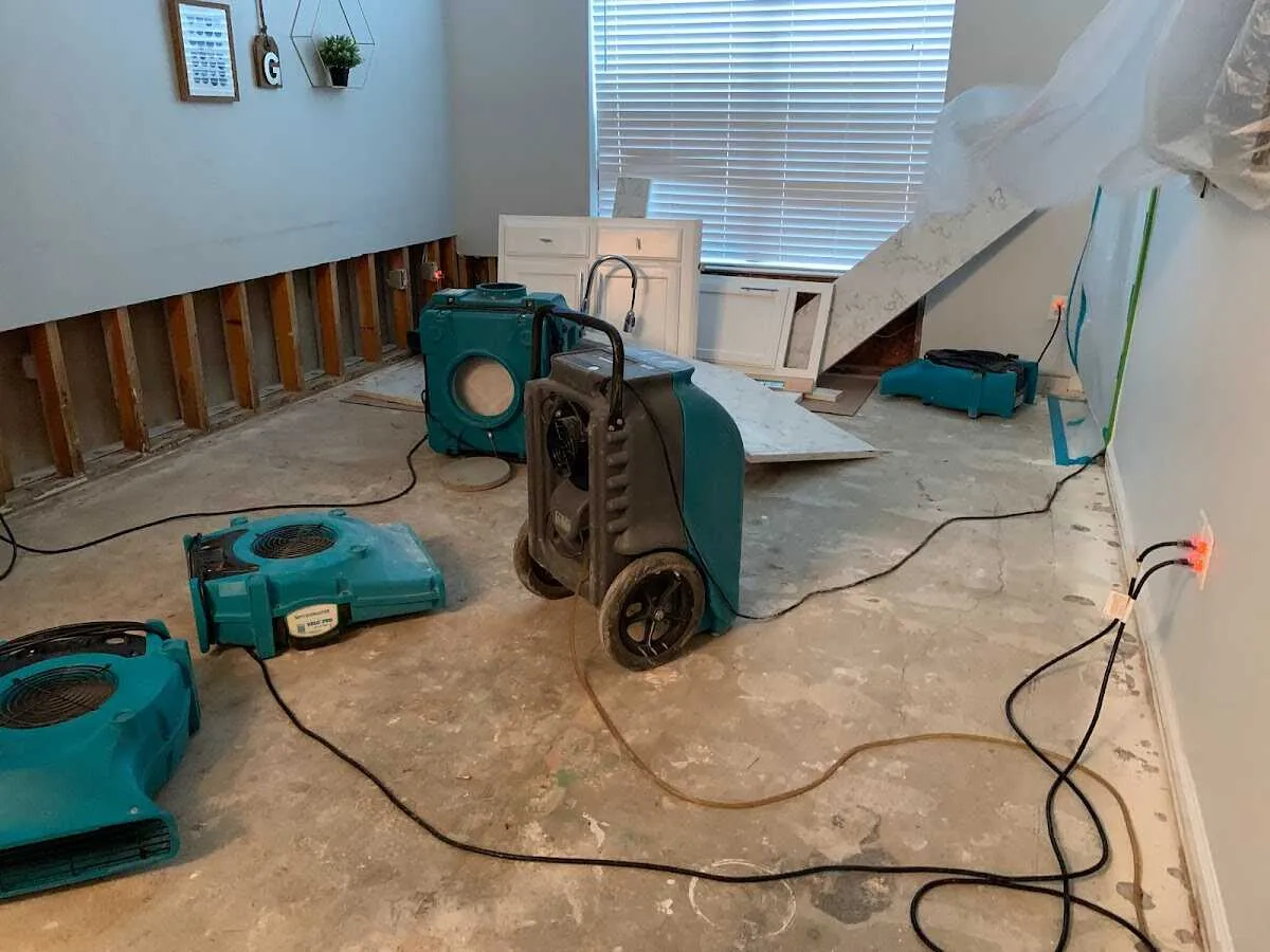 Dehumidifier in flood-cut room for Water Damage Restoration in Roma